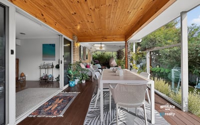 Experience effortless indoor-outdoor living with this spacious covered patio, perfect for gatherings and relaxation.