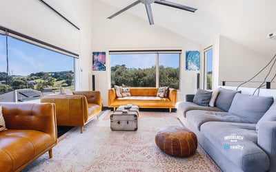 Bright and spacious living area featuring panoramic views, modern furnishings, and ample natural light throughout.