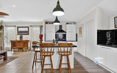 Modern kitchen with ample storage, featuring a central island and inviting dining area for casual meals.