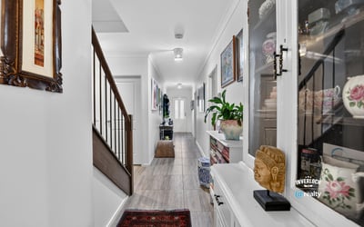 Discover a modern hallway featuring natural light, tasteful decor, and a welcoming ambiance throughout.