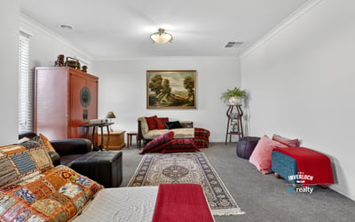 Spacious living area featuring diverse seating options and artwork, perfect for relaxation and gatherings.