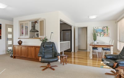 Bright and spacious living area features natural light and a seamless flow to the kitchen and dining space.