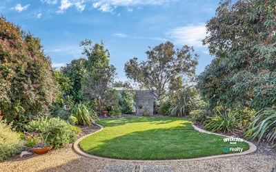 A spacious, landscaped garden offers a perfect outdoor retreat with abundant greenery and peaceful surroundings.