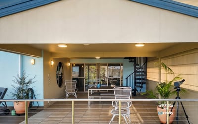 Spacious outdoor living area with panoramic views, perfect for entertaining or relaxing year-round.