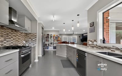 Modern kitchen featuring sleek cabinetry, a spacious layout, and contemporary appliances for culinary enthusiasts.