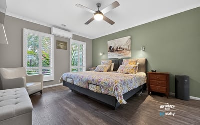 Bright and inviting bedroom featuring modern amenities and a tranquil view, perfect for relaxation.