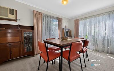 Bright and inviting dining area with ample natural light and a warm, welcoming atmosphere.