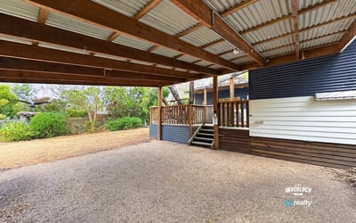 Spacious covered outdoor area perfect for gatherings and enjoying the surrounding natural landscape.