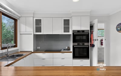 Modern kitchen with sleek cabinetry, high-quality appliances, and ample natural light creating an inviting atmosphere.