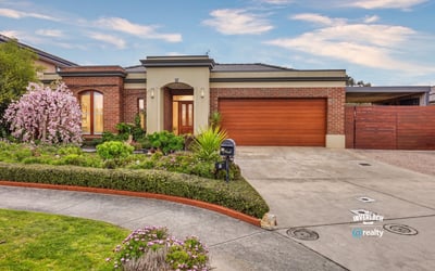 Discover this inviting home featuring lush landscaping, a spacious driveway, and ample natural light throughout.