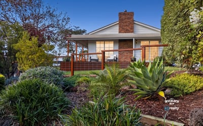 Discover a stunning home with expansive outdoor spaces and picturesque landscaping, perfect for relaxing or entertaining.