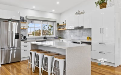 Bright, modern kitchen featuring sleek cabinetry, stainless steel appliances, and a spacious island for entertaining.