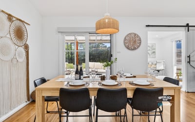 Bright dining area featuring natural wood accents, perfect for gatherings and everyday meals with family.