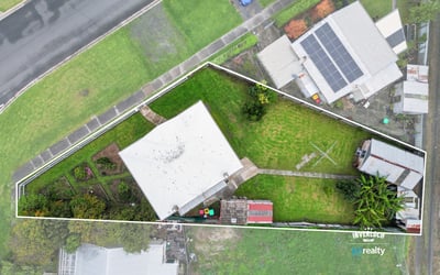 Spacious property featuring a generous yard and versatile layout, perfect for outdoor activities and potential expansions.