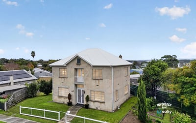 Spacious two-story home with ample outdoor space and panoramic views, perfect for family gatherings or relaxation.