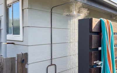 Experience outdoor living with this unique outdoor shower, perfect for refreshing after a day at the beach.