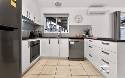 Modern kitchen featuring ample storage, stainless steel appliances, and a spacious layout for culinary creativity.