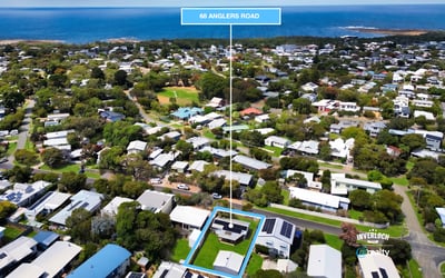 Discover a prime coastal property at 98 Anglers Road, surrounded by lush greenery and stunning ocean views.