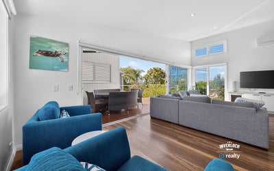 Modern open-concept living space featuring ocean views, ideal for entertaining and relaxation.