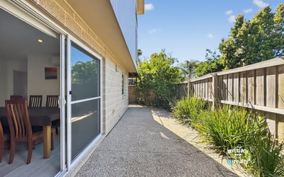 Spacious outdoor area offers a low-maintenance retreat, perfect for lounging or entertaining guests.