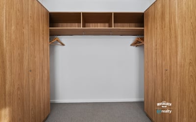 Spacious closet featuring ample storage with built-in shelving and hanging options for efficient organization.