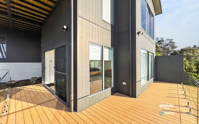 Contemporary design meets outdoor space in this inviting home with expansive decking and bright living areas.