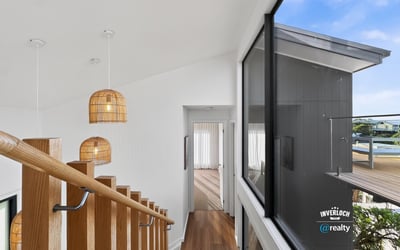 Modern open-concept design featuring natural light and unique pendant lighting, ideal for contemporary living.