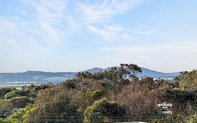 Breathtaking views of rolling hills and lush greenery create a captivating backdrop for your dream home.
