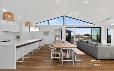 Spacious open-concept living area with modern finishes and abundant natural light, perfect for entertaining.