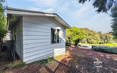 This contemporary home features a distinct design and abundant natural light in a peaceful neighborhood.