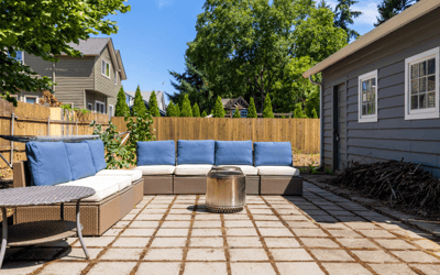 Spacious outdoor patio with comfortable seating and fire pit, perfect for gatherings and relaxation.