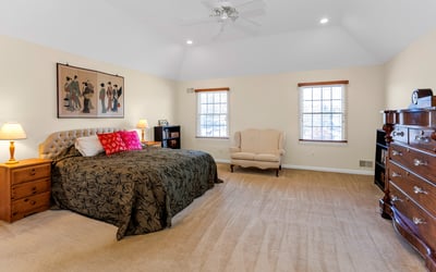 Unwind in the spacious and inviting Primary Suite with attractive tray ceiling, recessed lighting, and ceiling fan.