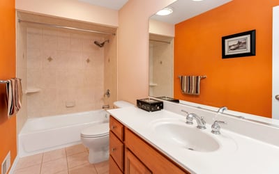 Hall Bathroom has a beautifully tiled shower/tub.