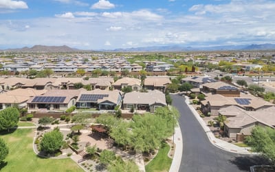 Elevated aerial perspective highlighting solar energy features, nearby park space, and a well-maintained Phoenix neighborhood. A smart blend of efficiency and outdoor surroundings.