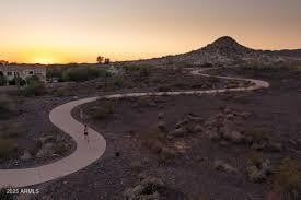 Explore miles of paved and lighted trails with desert views, ideal for evening strolls, biking, or connecting with neighbors.
