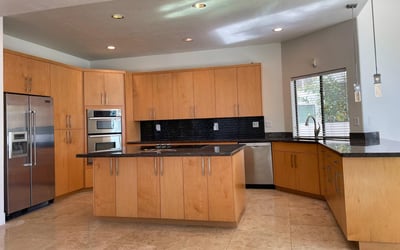 Open kitchen featuring premium appliances, wraparound counters, and generous storage combining practicality with modern elegance.