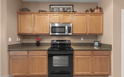 Featuring granite countertops, maple cabinets, and stainless appliances, this kitchen is designed for today s home chef with plenty of workspace.
