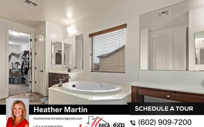 Featuring an extended vanity with dedicated makeup space and a large soaking tub, this primary bath blends style and functionality in this beautifully maintained Glendale home.