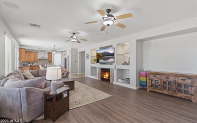 View of the large open living room connecting to the kitchen and dining areas, showcasing the modern floor plan designed for gatherings and everyday living.