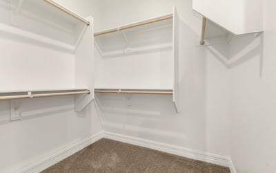 Large walk-in closet with built-in organization, ideal for maximizing storage and keeping everything neatly arranged.