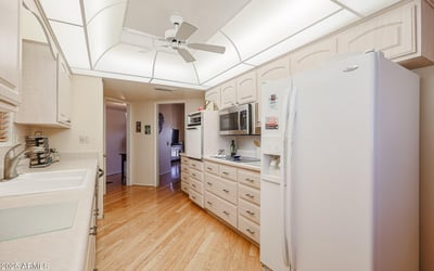 Functional kitchen with generous cabinet space, modern appliances, and efficient layout designed for everyday convenience.