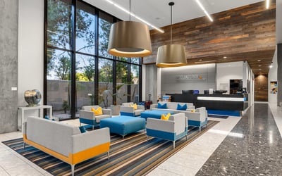 Stylish reception space with sleek desk, modern lighting, and updated interior design, offering a polished welcome in Phoenix.