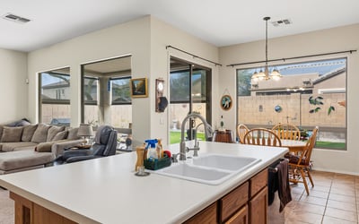 Open concept layout blending kitchen, dining, and living spaces for effortless entertaining and modern Phoenix living.