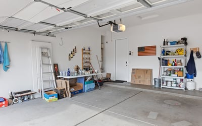 Spacious garage offering room for vehicles, tools, and storage, providing versatility and practicality in this Phoenix property.