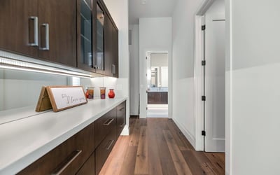 Custom hallway cabinetry with quartz countertop, adding storage and convenience to this well-designed Phoenix home.