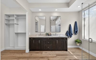 Elegant Scottsdale bathroom with dual sink vanity, quartz surfaces, and custom cabinetry, offering both luxury and convenience.