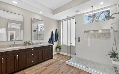Contemporary Scottsdale bathroom with a large walk-in shower, rainfall fixture, and sleek tile finishes for a spa-like experience.