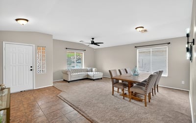 Large living and dining space with high ceilings and natural light. Flexible layout supports entertaining and comfortable living in Casa Grande.