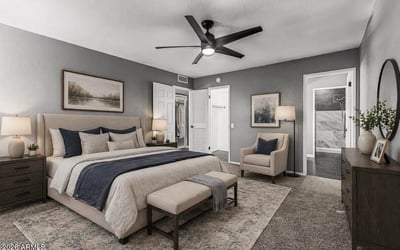 Beautifully staged bedroom emphasizing space, lighting, and modern finishes. This Sun City home showcases move-in ready interiors with contemporary updates.