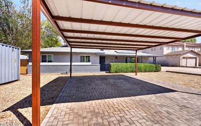 Extended driveway with direct unit access supports tenant convenience and enhances the usability of this Phoenix rental property.
